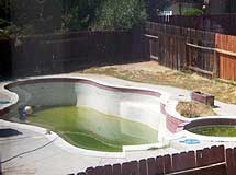 Abandoned pool with algae.