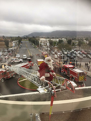 Santa on a fire ladder