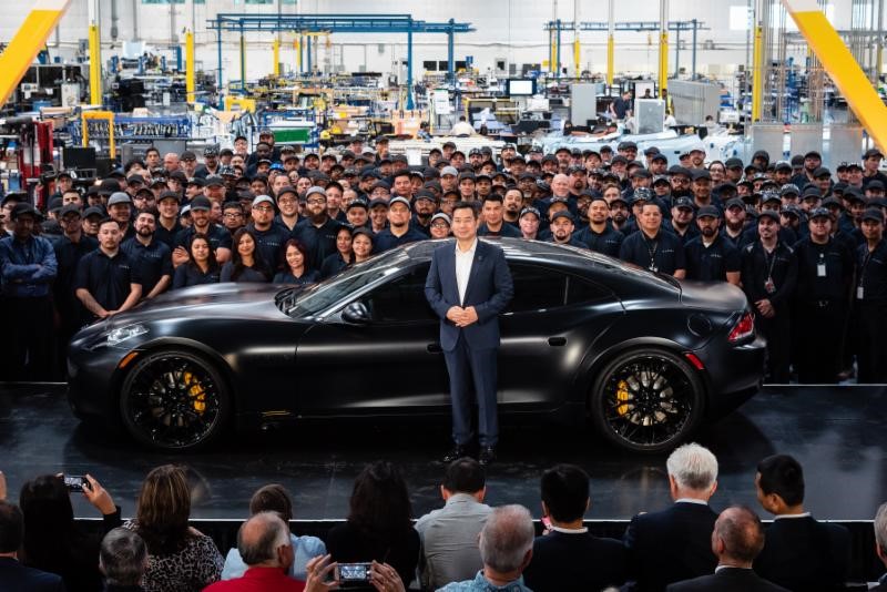 Karma CEO Dr. Lance Zhou on the factory floor with workers at the Moreno Valley plant.