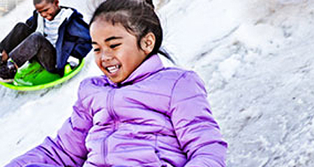 Child playing in the snow