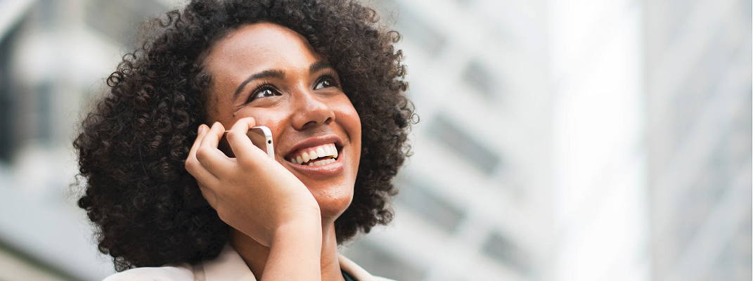 Young woman calling on a mobile phone.