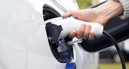 Plugging in an electric car.